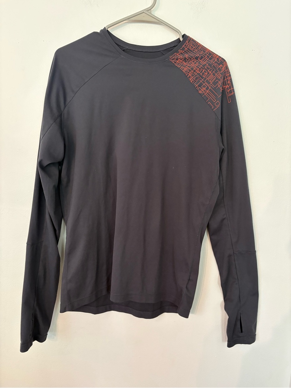 SUGOI Black Long-Sleeve Athletic Top with Red Shoulder Print